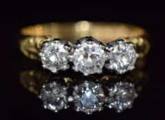 A late Victorian 18ct gold ring set with three diamonds of approximately 0.3ct, 0.22ct & 0.22ct, 4.