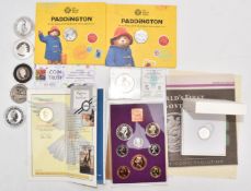 Small collection of coins including Paddington 50p, silver sovereign and 1970 year pack