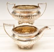 Georgian hallmarked silver sugar bowl and milk jug with wrythen reeded decoration and gadrooned
