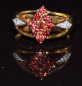 A 9k gold ring set with red sapphires and diamonds, 3.6g, size N