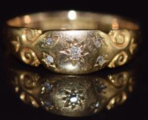 An 18ct gold ring with diamonds in a star setting, 2.2g, size O
