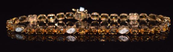 A 9ct gold bracelet set with citrine and diamonds, 6.4g