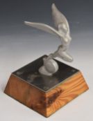 Triumph interest aluminium mascot on wooden base, overall height 18cm