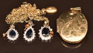 A 9ct gold locket, two 9ct gold chains and a 9ct gold pendant set with a sapphire and cubic