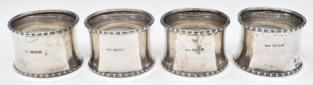 Set of four George V hallmarked silver napkin rings, Birmingham 1925, maker Docker & Burn Ltd,