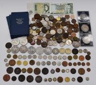 A collection of UK and overseas coinage, some silver content, includes a worn George III crown and a