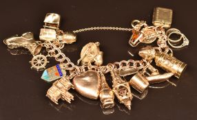 A 9ct gold charm bracelet with over seventeen 9ct gold charms including Bath Abbey, ship's wheel, St