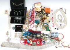 A collection of costume jewellery including crystal beads, necklaces, brooches, etc