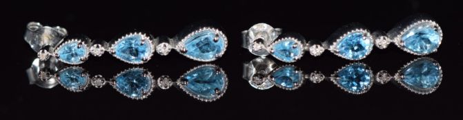A pair of 9k white gold earrings set with topaz and diamonds, 5g