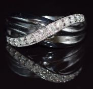 A 9ct white gold ring set with diamonds in twist design, 3.6g, size N