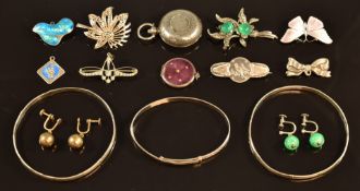 A silver hammered sovereign holder, two silver bamboo bangles, JA & S enamel butterfly brooch,