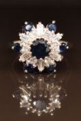 An 18ct white gold ring set with sapphires, round cut and baguette cut diamonds, 5.2g, size K