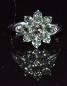 A 9k white gold ring set with green sapphires, 3.4g, size N