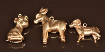 Three 9ct gold charms/ pendants comprising donkey, ram and dog, 4.8g