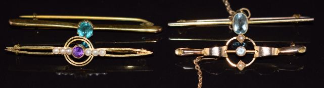 Two 9ct gold Edwardian brooches set with seed pearls, amethyst and aquamarine, and two 9ct gold