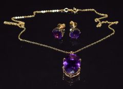 A 9ct gold pendant set with an oval cut amethyst (5.6g, approximately 16ct), on 14k gold chain, with