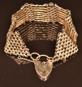A 9ct gold gate bracelet with heart padlock clasp, 25.9g