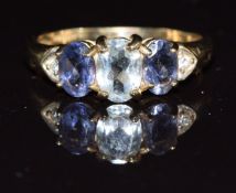 A 9k gold ring set with an oval cut aquamarine, iolite and diamonds, 2.5g, size Q