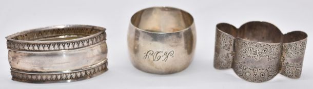 Three silver napkin rings comprising two hallmarked examples and one continental example, weight