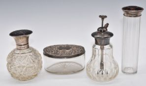 Four silver topped dressing table pots including two tortoiseshell examples, height of tallest 15cm
