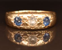 Victorian 18ct gold ring set with a diamond and sapphires in star settings, London 1897, 5.1g,