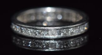 An 18ct white gold eternity ring set with thirty princess cut diamonds totalling approximately 1.