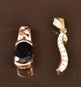 Two 9k gold pendant, one set with diamonds the other Shangdong sapphire and diamonds, 3.4g