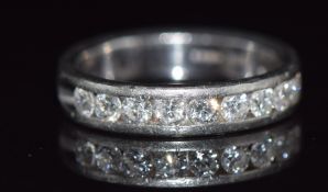 A platinum half eternity ring set with diamonds, each measuring approximately 0.08ct, 7.3g, size M
