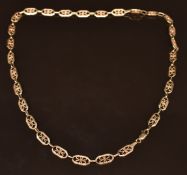 A 9ct gold necklace made up of pierced floral links, 11.2g, 23cm long
