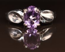 A 9ct white gold ring set with an oval cut amethyst, 2.3g, size M