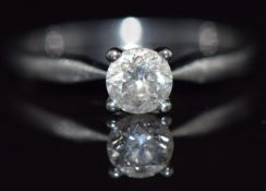 A platinum ring set with a round brilliant cut diamond of approximately 0.5ct, 3.3g, size L