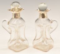 Pair of George V hallmarked silver novelty miniature handled glug decanters, Birmingham 1909,