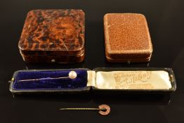 A yellow metal stick pin set with a pearl, in box, a horseshoe stick pin and two vintage jewellery