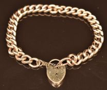 A 9ct gold curb link bracelet with heart padlock clasp, 10.8g
