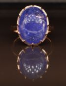 An 18ct gold ring set with a 14ct tanzanite cabochon, 6.6g, size M