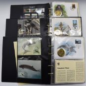 World Wildlife Fund coin and stamp covers collection, in three albums