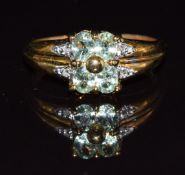 A 9k gold ring set with garnets and diamonds, 2.8g, size M