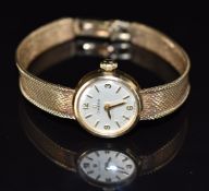 Omega 9ct ladies wristwatch ref. 711.5656 with gold hands and hour markers, silver dial and signed