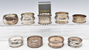 Nine various hallmarked silver napkin rings including a pair, weight 121g