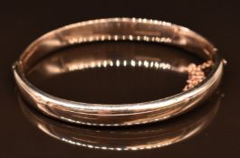 A yellow metal bangle, 12.1g, 6 x 5cm