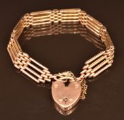 A 9ct rose gold gate bracelet with heart padlock clasp, 19.5g