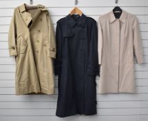 Three trench coats by Burberry's, including a gent's size 48R and ladies size 6 petite