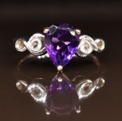 A 9ct white gold ring set with a pear cut amethyst, 3.3g, size N