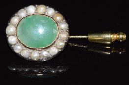 Victorian stick pin set with an oval cut agate surrounded by split pearls, 11.1g