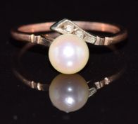 A 9ct gold ring set with a pearl and white sapphires, 1.9g, size L