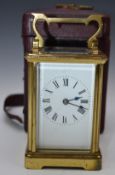 Brass cased carriage clock striking on a gong, in original travelling case, overall height 15cm