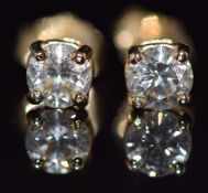 A pair of 18k gold earrings set with a diamond of approximately 0.35ct to each