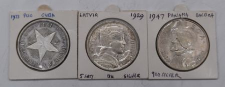 Latvia 5 Lati silver coin, 1929, together with a 1933 Cuban un Peso and a 1947 Panama Balboa