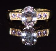 A 9k gold ring set with kunzite and pink sapphires, 3.8g, size M