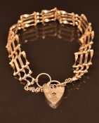 A 9ct gold gate bracelet with heart padlock clasp, 9.3g